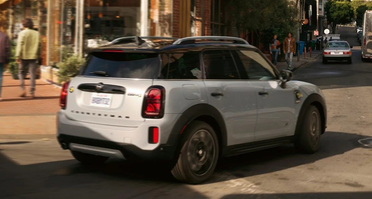 The MINI Cooper SE Countryman PHEV turning a corner in the city. MINIDemo3 in Derwood MD